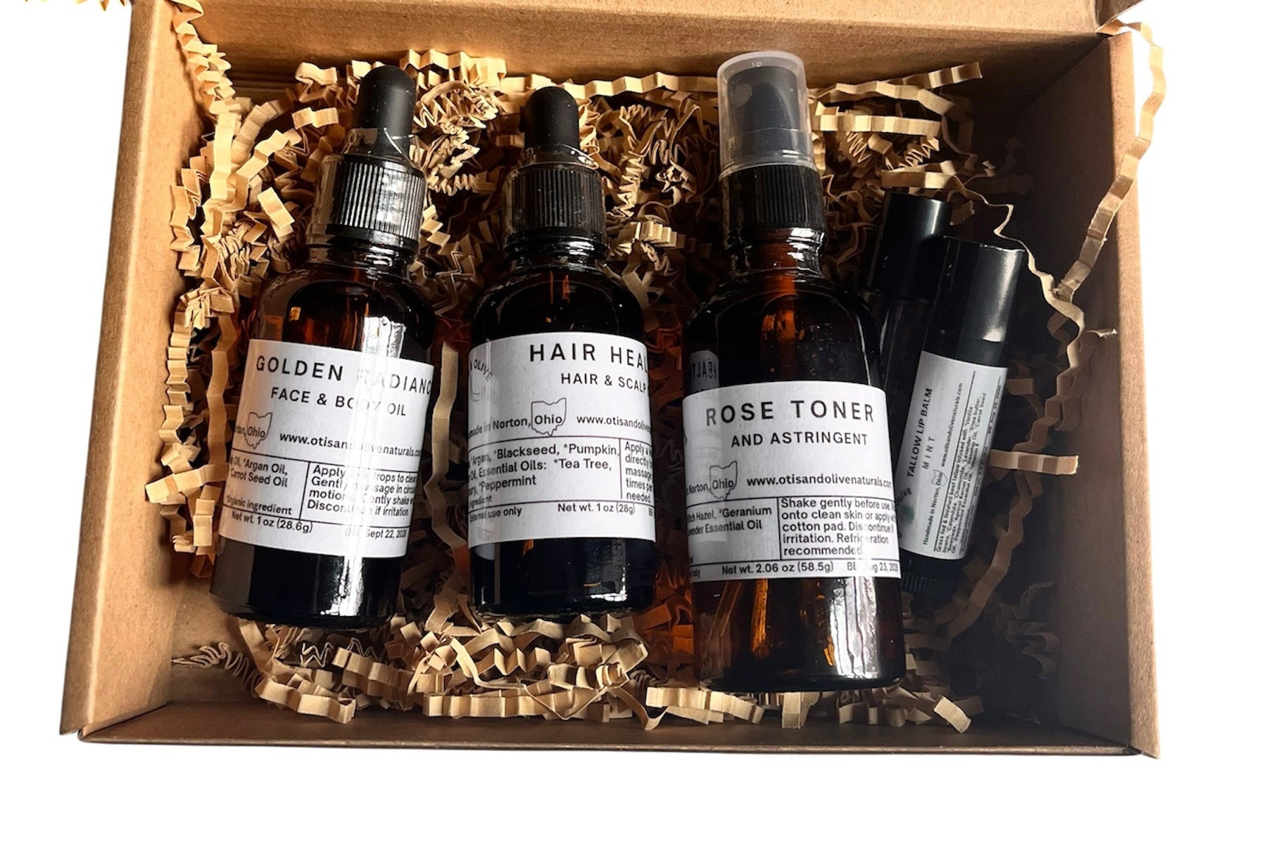 Collection of small bottles for hair, face, eye lashes and lips.